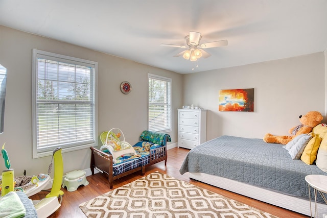 3325 Blackmon Ln, Beaumont, TX 77703 - bedroom with wood finished floors, baseboards, and ceiling fan