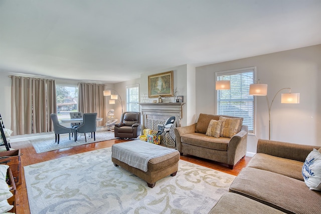 3325 Blackmon Ln, Beaumont, TX 77703 - living area featuring wood finished floors, a fireplace, and baseboards
