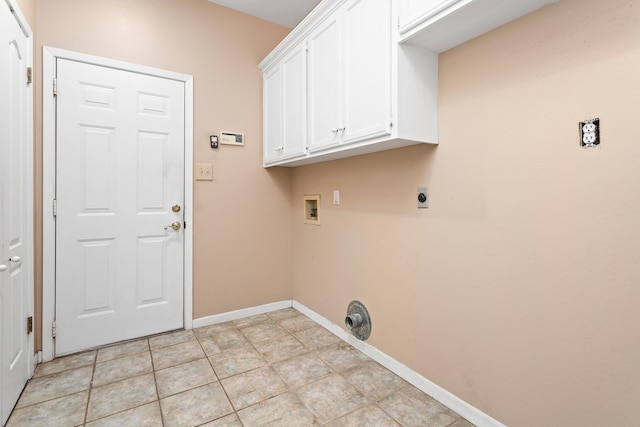 washroom featuring washer hookup, electric dryer hookup, and cabinets