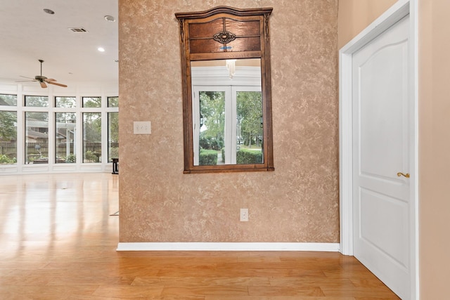 interior space featuring light hardwood / wood-style floors and ceiling fan