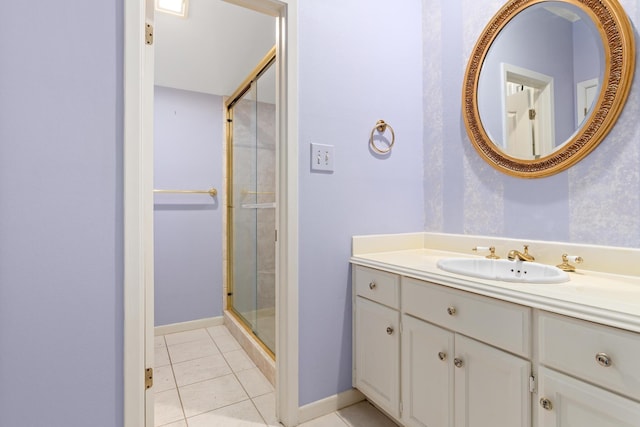 bathroom with vanity, tile patterned floors, and a shower with door