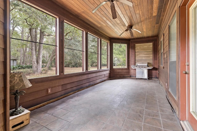 unfurnished sunroom featuring wood ceiling