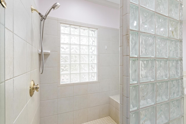 bathroom with a tile shower