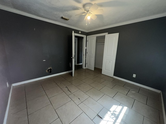 5333 Lakeside Dr, Port Arthur, TX 77642 - unfurnished bedroom with light tile patterned flooring, ornamental molding, a closet, and a ceiling fan