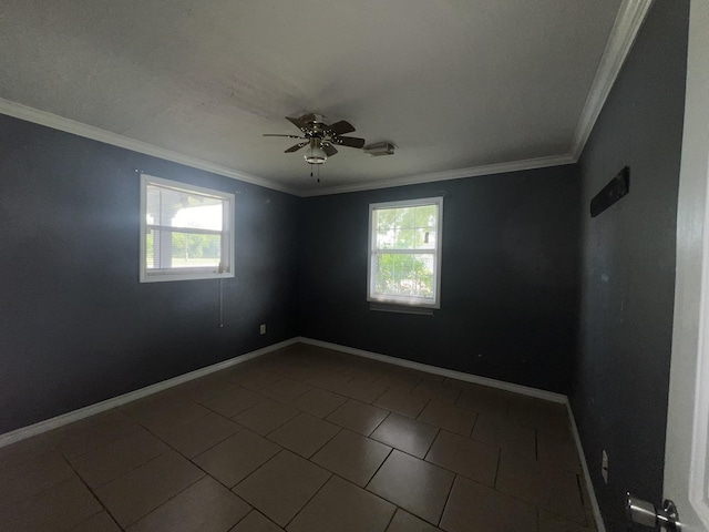 5333 Lakeside Dr, Port Arthur, TX 77642 - unfurnished room with healthy amount of natural light, dark tile patterned flooring, ceiling fan, and crown molding