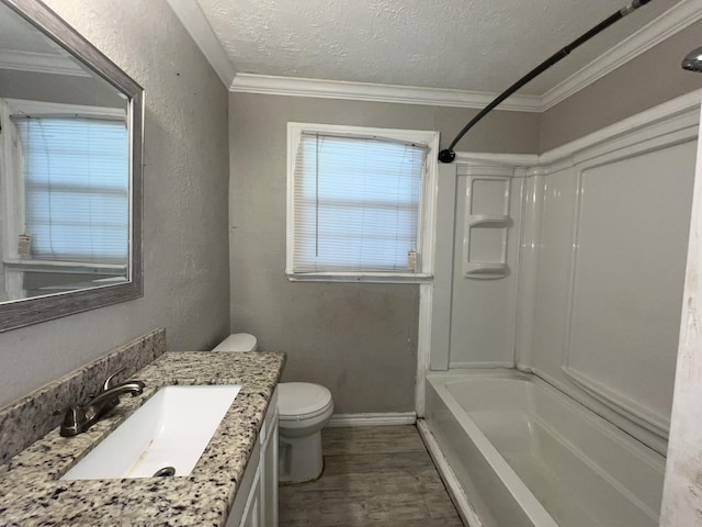 5333 Lakeside Dr, Port Arthur, TX 77642 - bathroom featuring a textured ceiling, vanity, crown molding, wood finished floors, and bathing tub / shower combination