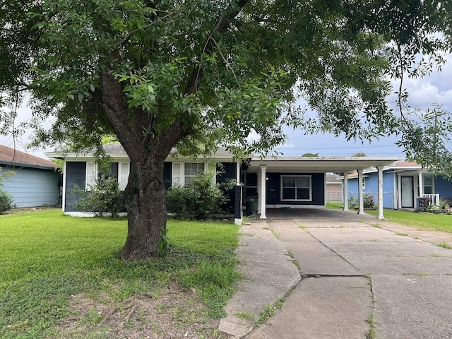 5333 Lakeside Dr, Port Arthur, TX 77642 - single story home with a front lawn, driveway, and an attached carport