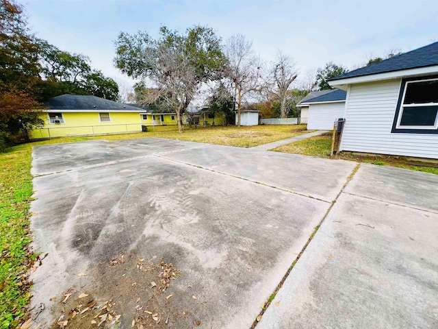 view of patio with a storage unit