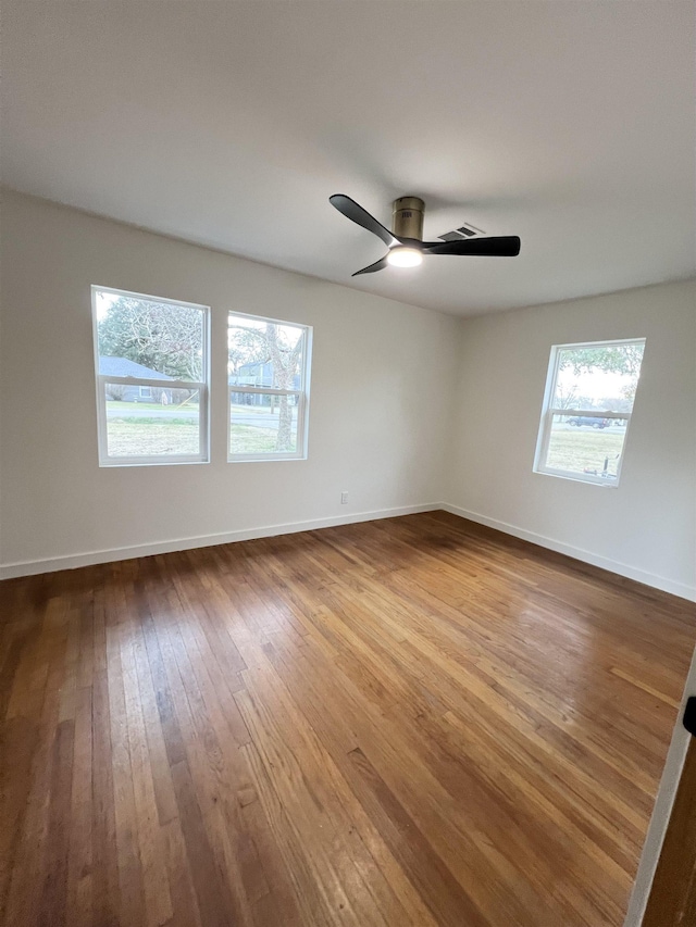 unfurnished room featuring hardwood / wood-style flooring and ceiling fan