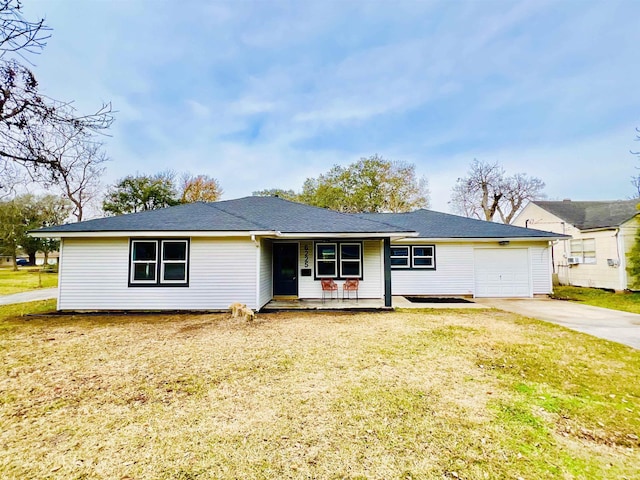 ranch-style home with a garage, covered porch, and a front lawn