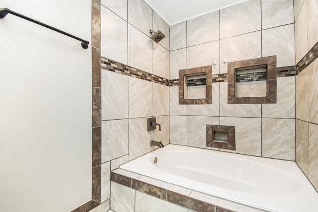 bathroom featuring tiled shower / bath combo