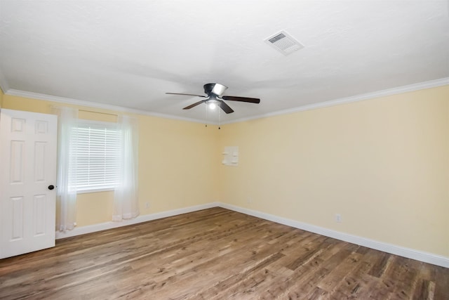 unfurnished room with ceiling fan, crown molding, and hardwood / wood-style floors