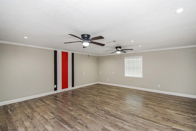 empty room with a textured ceiling, ceiling fan, crown molding, and wood-type flooring