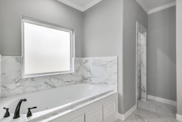 full bath with baseboards, a garden tub, marble finish floor, and ornamental molding