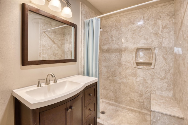 bathroom with vanity and curtained shower