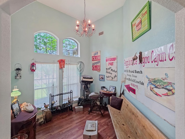 404 Pintail Ln, Orange, TX 77630 - rec room featuring wood finished floors, high vaulted ceiling, and a chandelier