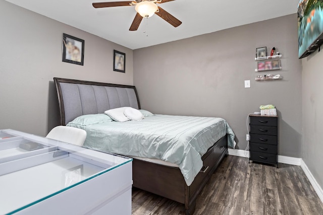 bedroom with ceiling fan and dark wood-type flooring