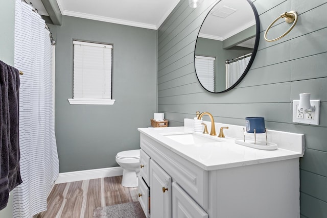 bathroom with hardwood / wood-style floors, vanity, toilet, and crown molding