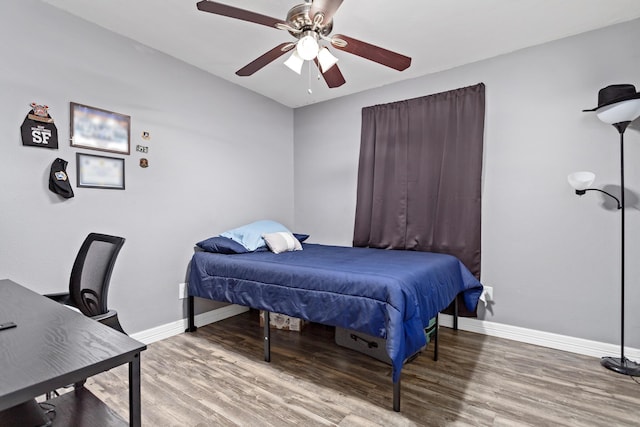 bedroom featuring hardwood / wood-style flooring and ceiling fan