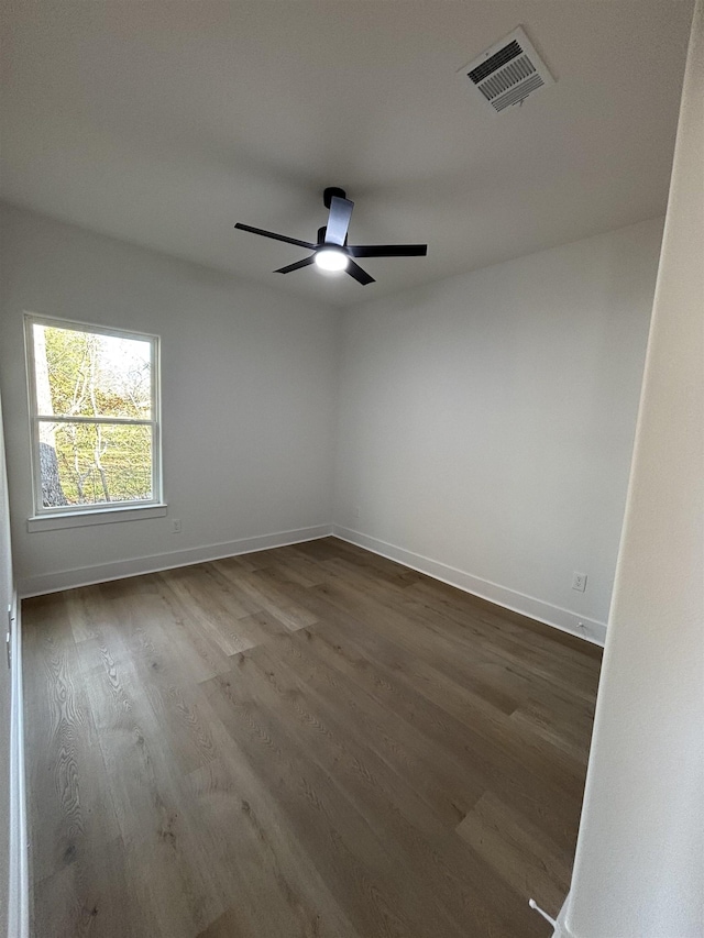 spare room featuring wood-type flooring