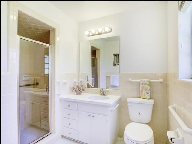 5390 Swallow Dr, Beaumont, TX 77707 - bathroom featuring toilet, a shower stall, and vanity