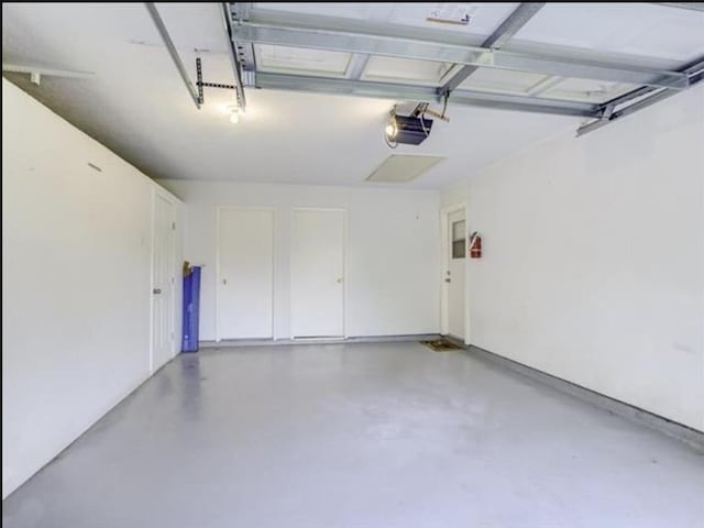 5390 Swallow Dr, Beaumont, TX 77707 - garage with a garage door opener