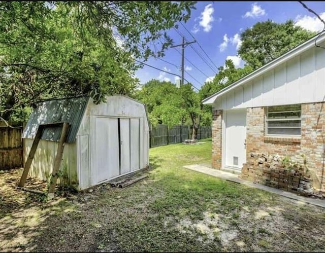5390 Swallow Dr, Beaumont, TX 77707 - view of yard with an outbuilding, a shed, and a fenced backyard
