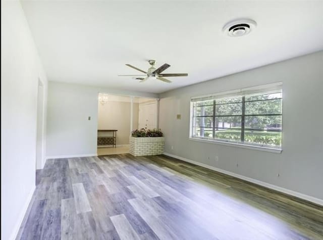 5390 Swallow Dr, Beaumont, TX 77707 - unfurnished living room with visible vents, baseboards, and a ceiling fan