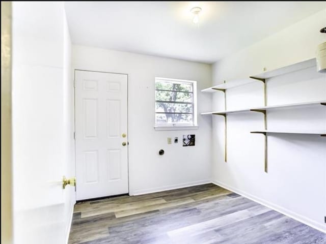 5390 Swallow Dr, Beaumont, TX 77707 - washroom with baseboards, wood finished floors, laundry area, and washer hookup