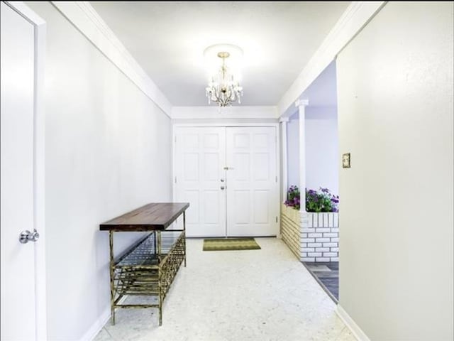 5390 Swallow Dr, Beaumont, TX 77707 - entrance foyer featuring decorative columns, a notable chandelier, and baseboards