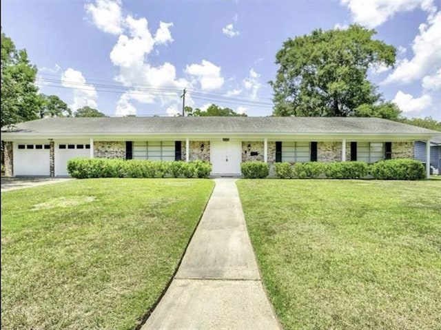 5390 Swallow Dr, Beaumont, TX 77707 - ranch-style home with driveway, a front lawn, and a garage