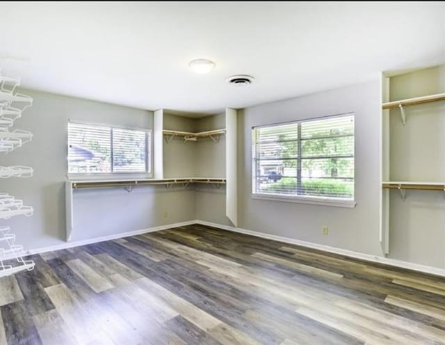 5390 Swallow Dr, Beaumont, TX 77707 - walk in closet with visible vents and wood finished floors