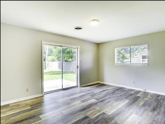 5390 Swallow Dr, Beaumont, TX 77707 - unfurnished room featuring visible vents, baseboards, and wood finished floors