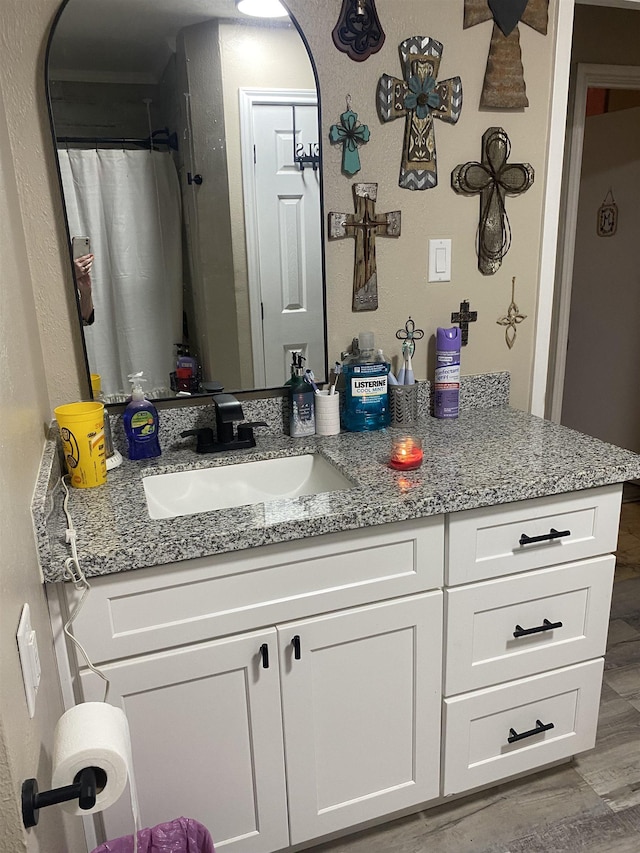 6033 Stones Throw Dr, Silsbee, TX 77656 - bathroom with vanity and wood finished floors