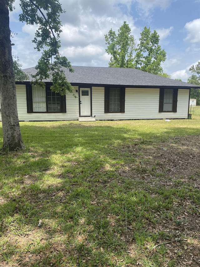 6033 Stones Throw Dr, Silsbee, TX 77656 - ranch-style house with a front lawn