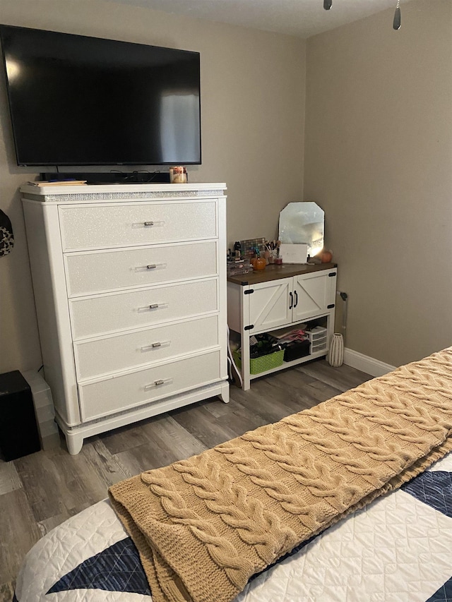 6033 Stones Throw Dr, Silsbee, TX 77656 - bedroom featuring dark wood-type flooring and baseboards