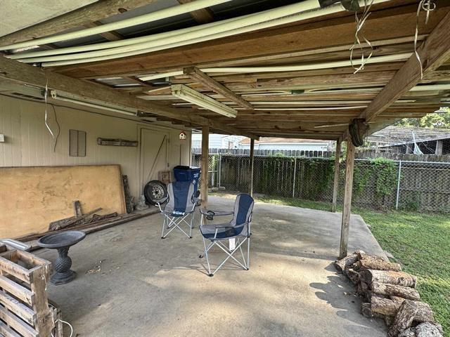 view of patio / terrace featuring fence