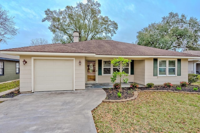 ranch-style house featuring a front yard and a garage