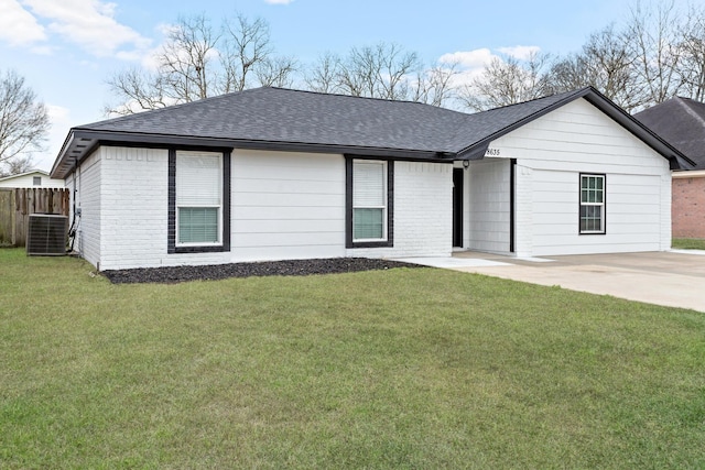 single story home with brick siding, roof with shingles, central air condition unit, a front yard, and fence