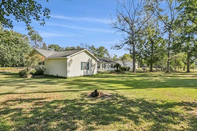 view of property exterior featuring a lawn