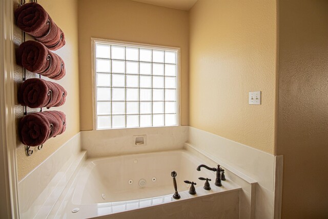 bathroom featuring a tub