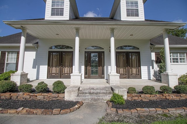 doorway to property with covered porch