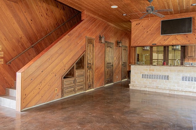 interior space featuring high vaulted ceiling, sink, wooden walls, ceiling fan, and wood ceiling