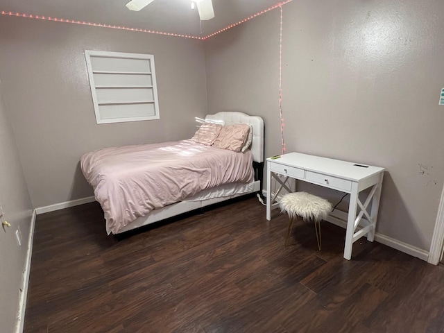 bedroom with ceiling fan and dark hardwood / wood-style flooring