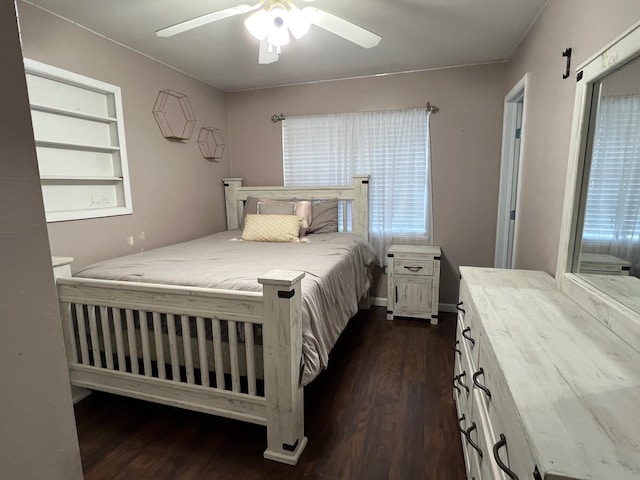 bedroom featuring ceiling fan and dark hardwood / wood-style floors