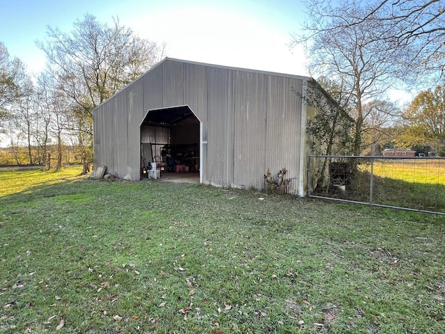 view of outdoor structure with a lawn