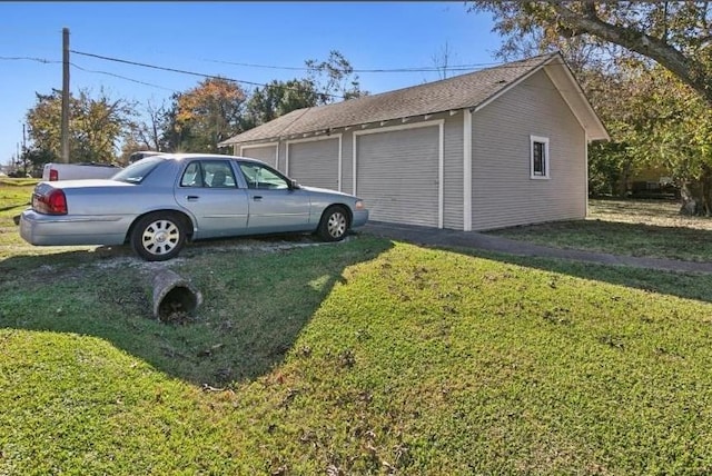 garage with a yard