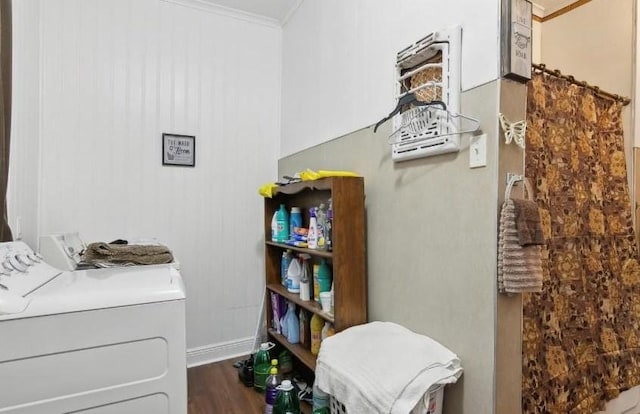 washroom with independent washer and dryer, dark hardwood / wood-style flooring, and ornamental molding