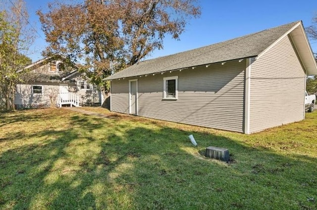 view of side of property with a yard