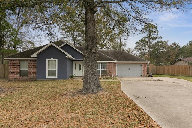 single story home with a garage and a front lawn